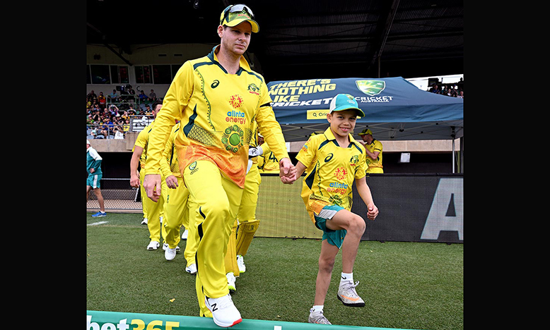 Andrew Symonds’ son Will walking out with Steve Smith // Getty