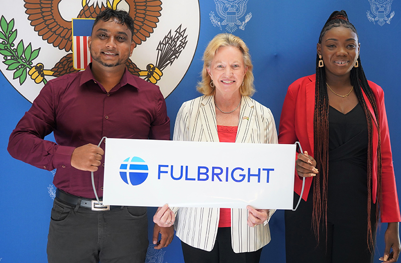 Ambassador Lynch with Fulbright scholarship awardees Bayeeshmaal Ramsundar (left) and Keesha St. John