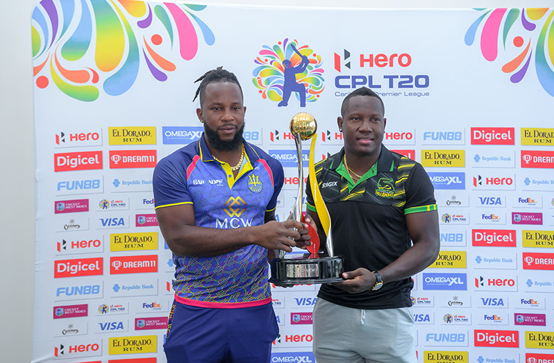 Barbados Royals captain Kyle Mayers (left) and Jamaica Tallawahs captain Rovman Powell with the Hero CPL trophy on the eve of the 2022 final in Providence tonight.(Delano Williams photo)