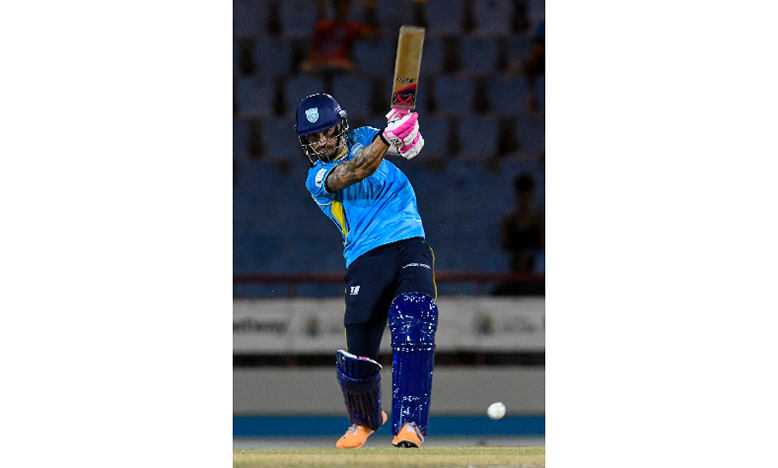 Kings captain Faf du Plessis drives down the ground during his half-century on Sunday night. (Photo: Getty/CPL)