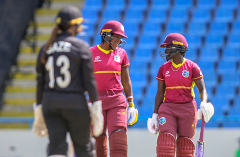 Top-scorer Chinelle Henry (middle) chats with Kyshona Knight during their half-century stand on Monday. (Photo courtesy CWI)