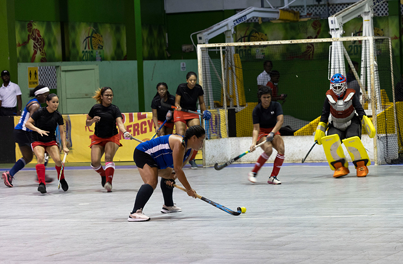 In photo Tiffany Solomon (GBTI GCC Tigers) takes a shot on goal in a penalty corner against Old Fort Igniters