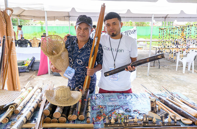Mackernol Albert and one of his sons at the arts, craft and cuisine exhibition (Delano Williams photo)