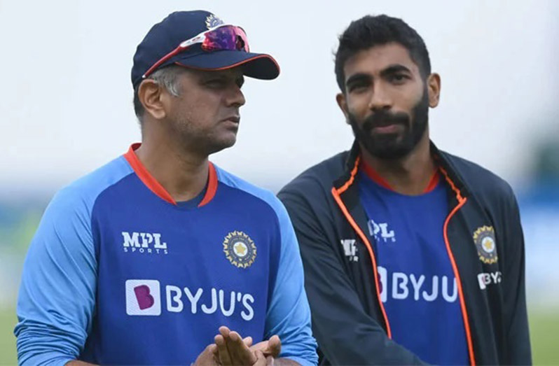 India coach Rahul Dravid (left) and pacer Jasprit Bumrah