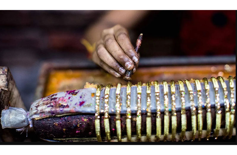 Traditionally, glass bangles produced in the city were decorated with pure gold polish (Xavier Galiana/Getty Images)