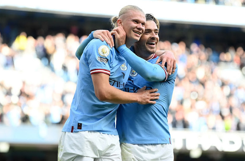 Erling Haaland of Manchester City celebrates his side's fifth goal and his hat trick with team mate Jack Grealish in the Premier League match against Manchester United at Etihad Stadium in Manchester on October 2 2022. 
Image: Michael Regan/Getty Images