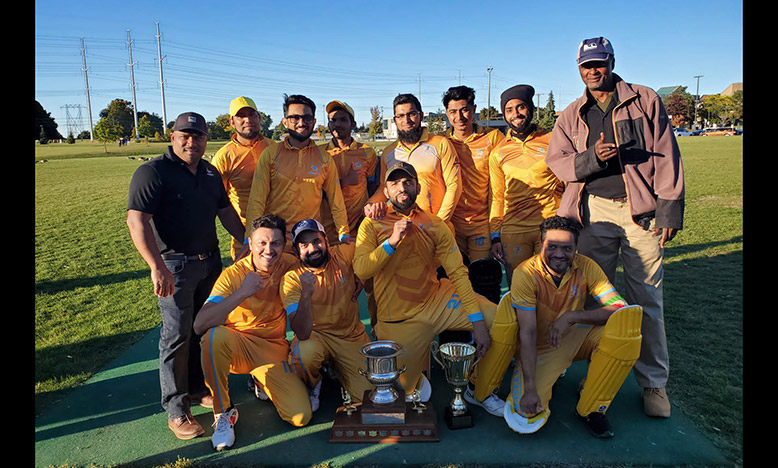 The victorious Naseeb CC players with SCA executives, secretary Eon Gunraj (extreme left) and grounds coordinator Calvin Alexander (extreme right)