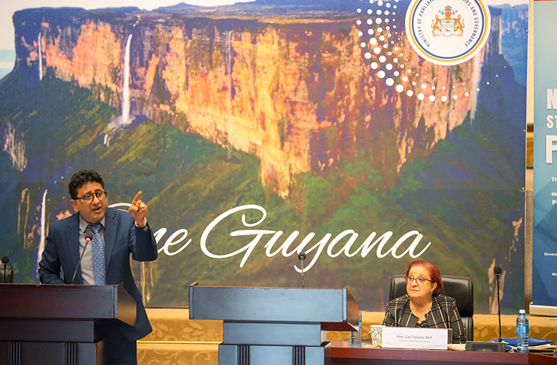 Attorney General, Anil Nandlall S.C. (left) and Minister of Parliamentary Affairs and Governance, Gail Teixeira (seated at right) (Delano Williams photo)