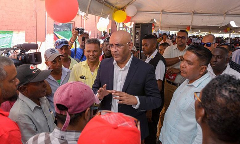 Vice-President, Dr Bharrat Jagdeo and Agriculture Minister, Zulfikar Mustapha addressing the concerns of fisherfolk at the MMA-ADA during a recent distribution exercise in Region Five (Delano Williams photo)