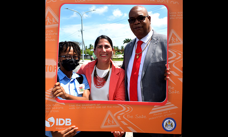 A student of the East Ruimveldt Secondary School; Country Representative of IDB, Lorena Solorzano-Salazar and Public Works Minister, Juan Edghill share a light moment following the launch of the highway safety video campaign (Elvin Croker photo)