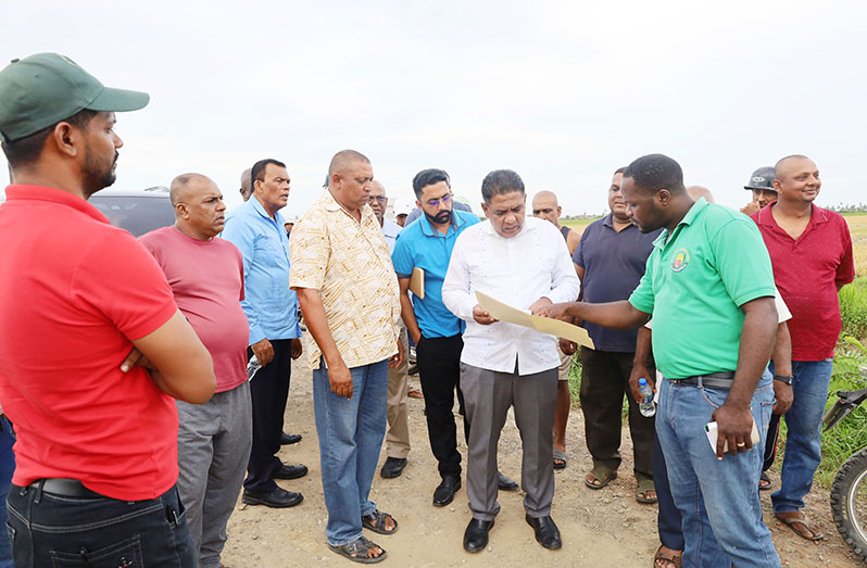 Agriculture Minister Zulfikar Mustapha engaging farmers during his visit to Windsor Forest on Thursday
