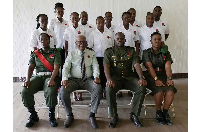 (Seated) Senior GDF ranks with the ten soldiers that commenced the garment construction training