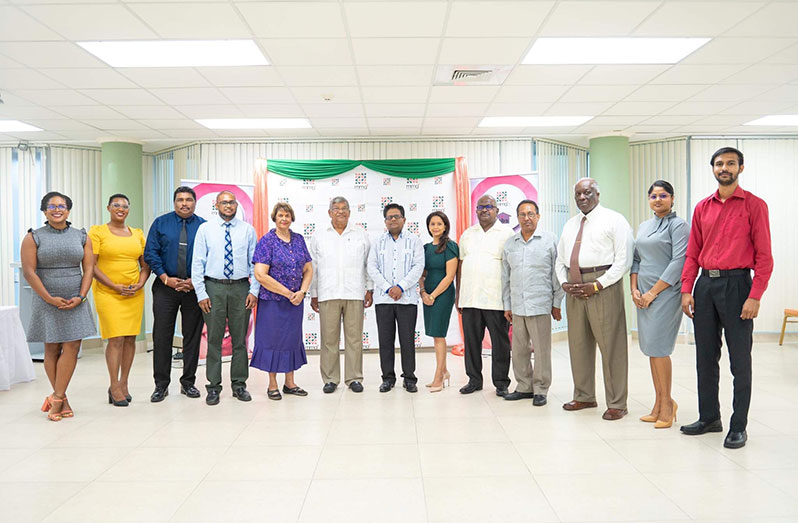 (seventh from right) Senior Minister in the Office of the President with responsibility for finance, Dr Ashni Singh; (to his left) MMG General Manager Bobita Ram; (sixth from left) NBS Chairman, Dr Nanda Gopaul, flanked by staff from MMG and NBS (GTT photo)