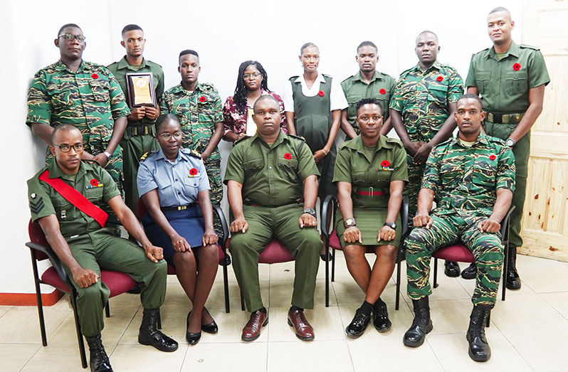 Officer Commanding of the Medical Corps, Major Fidel Fredericks (seated in centre), flanked by other senior ranks and the successful soldiers who completed training on the Grade Three Photography Course (GDF photo)