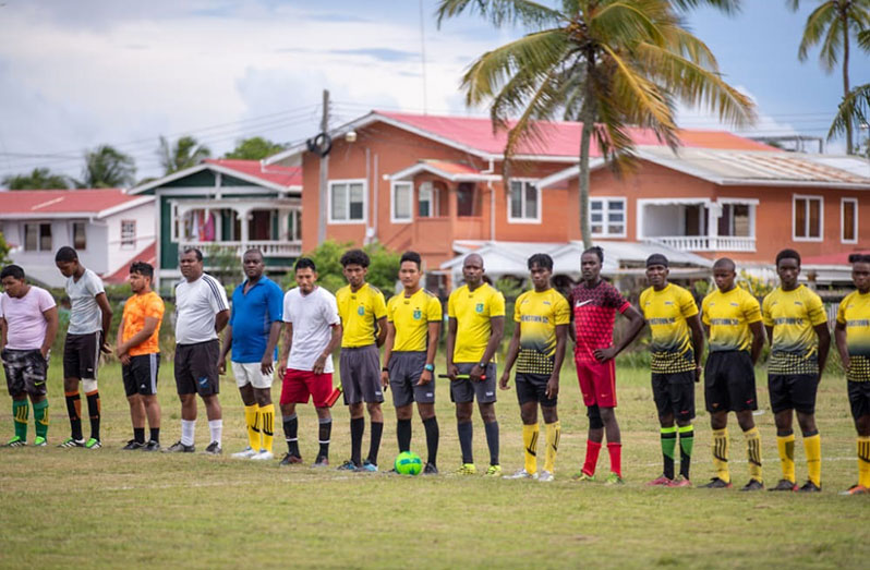 Players line up before kick-off (Queenstown in yellow)