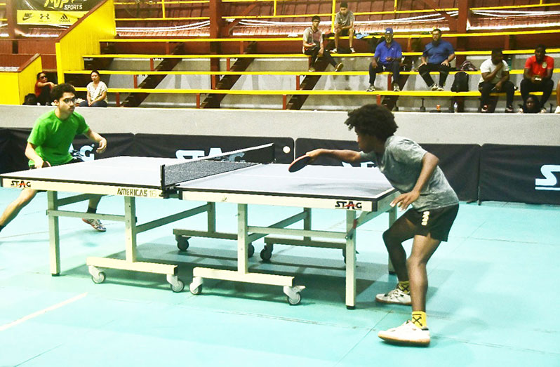 Ebo McNeil of Guyana (right) and Shariq Bipat battling it out at the National Gymnasium