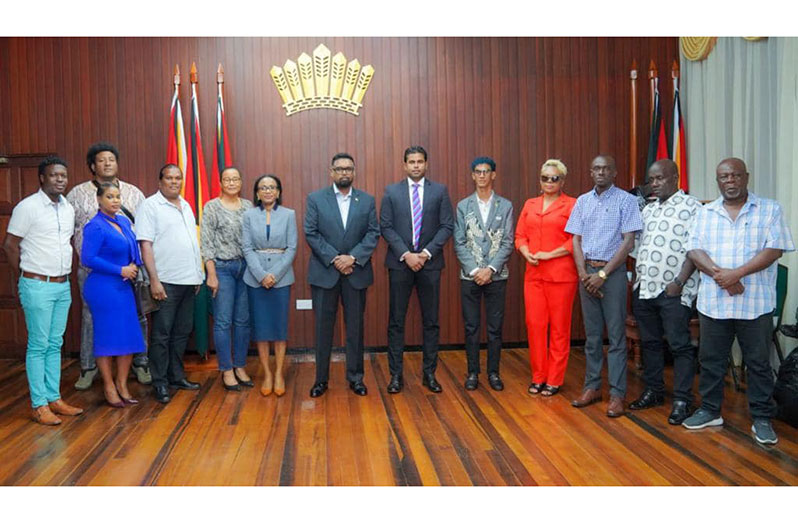 President Ali (centre) with the designers after the meeting. Also pictured in this Office of the President photo are Minister of Tourism, Industry and Commerce, Oneidge Walrond (fourth from left) and Minister of Culture, Youth and Sport, Charles Ramson Jr (sixth from right)
