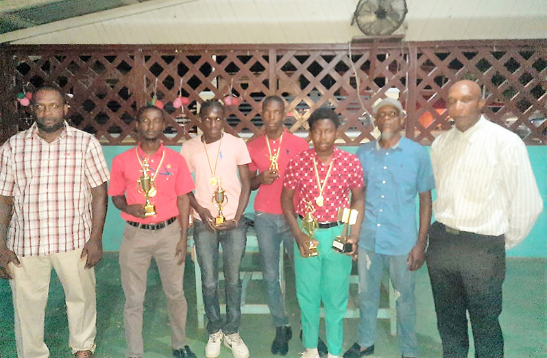 The Buxton Carl Hooper CC's Awardees with officials; 2nd from left is Cricketer-of-the-Year Owen Andries, while president Esse Peters is 2nd from right