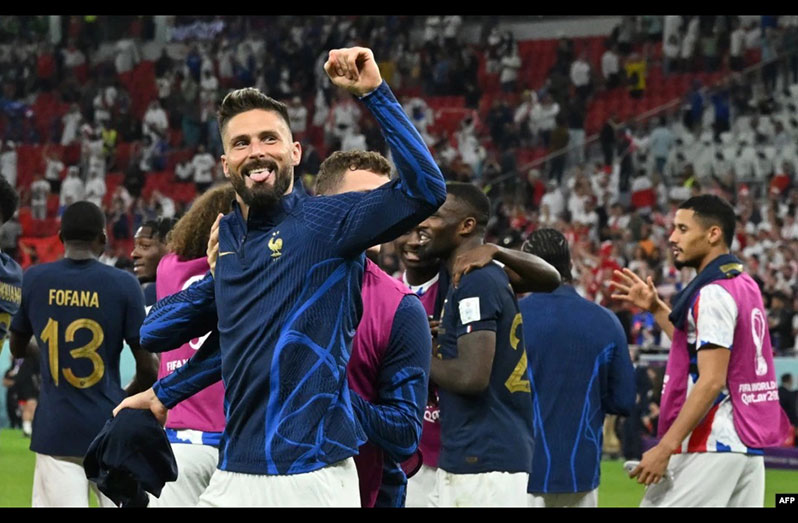France's forward #09 Olivier Giroud greets the supporters after the Qatar 2022 World Cup round of 16 football match between France and Poland at the Al-Thumama Stadium in Doha..