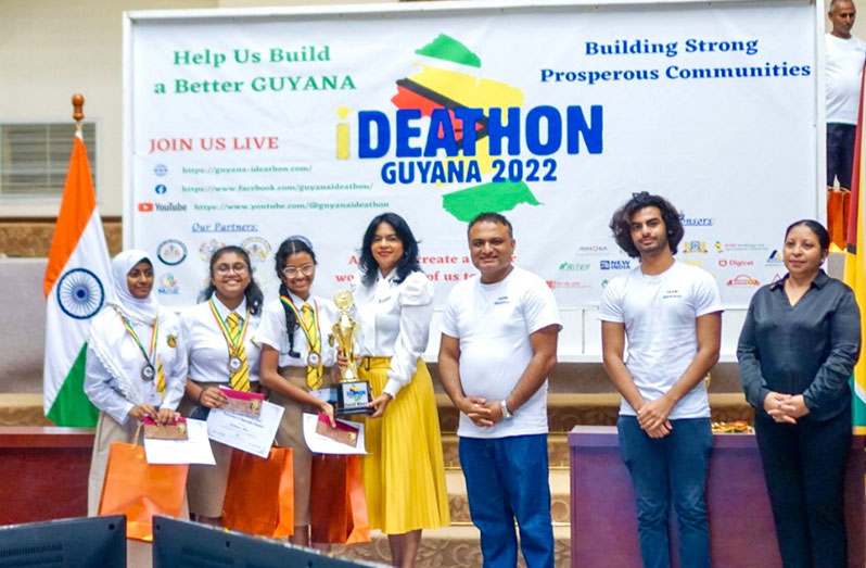 (From left) Vice Chancellor of the University of Guyana, Prof. Paloma Mohamed; Promoter of Ideathon, Athrav Kotehal Gowdara; High Commissioner of India to Guyana, Dr K J Srinivasa and Minister for Public Service, Sonia Parag, with Queen’s College winners of the competition