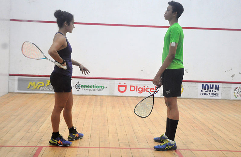 Guyana’s most accomplished squash player Nicolette Fernandes conducts a coaching session with Joshua Verwey, who will participate in Canada and the United States this month. (Sean Devers photo)