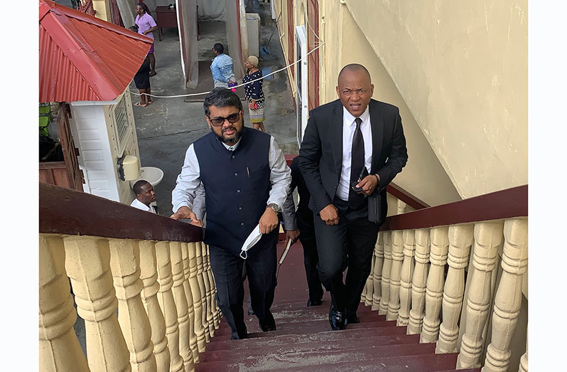 Georgetown Mayor Ubraj Narine (left) and Opposition Member of Parliament Sherod Duncan, making their way to the Chief Magistrate’s court