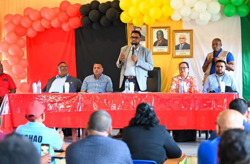 President, Dr. Irfaan Ali addresses residents of Port Kaituma as ministers and other officials look on