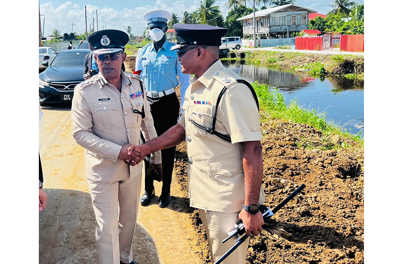 Commissioner of Police (ag), Clifton Hicken, greets divisional commander, Senior Superintendent Shivpersaud Bacchus, on his arrival at the Christmas Luncheon and Awards Ceremony