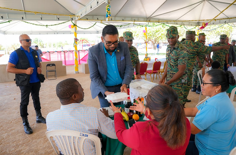 President, Dr Irfaan Ali served lunch to the soldiers and their guests