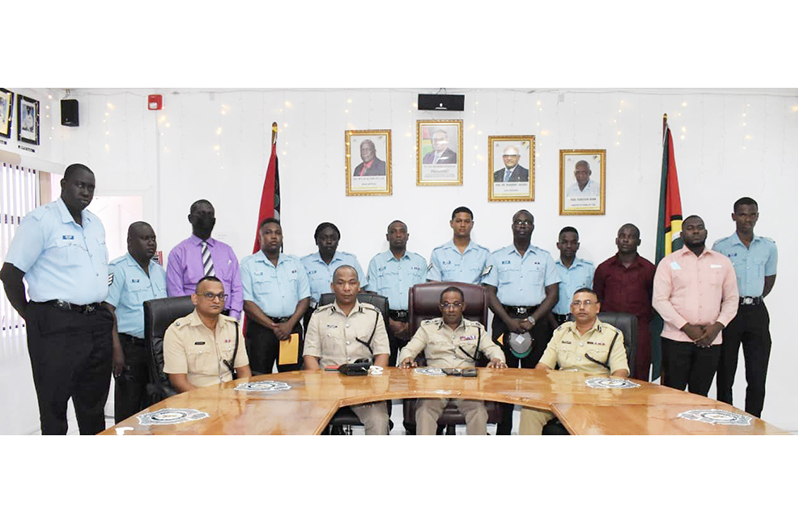 (Seated from right) Regional Commander, Assistant Commissioner Khali Pareshram; Commissioner of Police (ag), Clifton Hicken; Deputy Commissioner ‘Administration’ (ag), Calvin Brutus; Head of the Finance Department, Superintendent B. Persaud, flanked by the police ranks that were rewarded for their notable actions