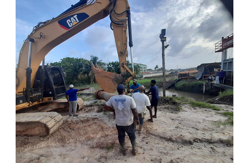 Engineers conducting works at the Peter’s Hall sluice (Ministry of Agriculture photo)