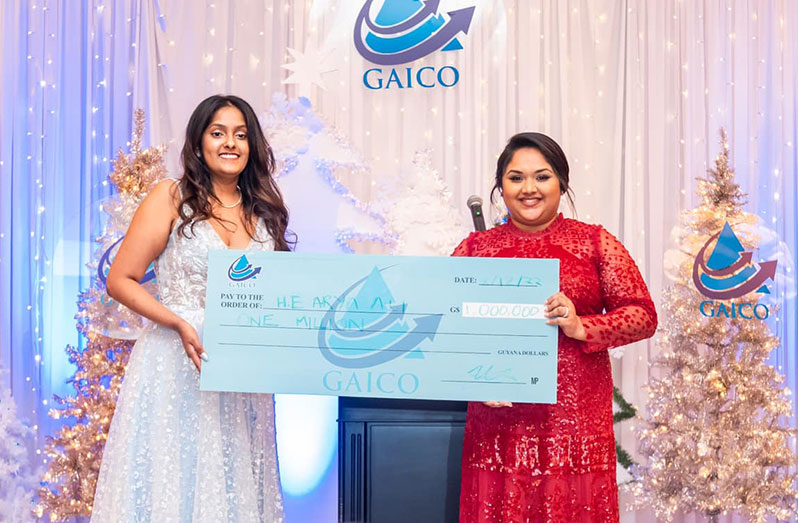A representative of GAICO Construction & General Services Inc hands over the sponsorship cheque to First Lady Arya Ali (Office of the First Lady photo)