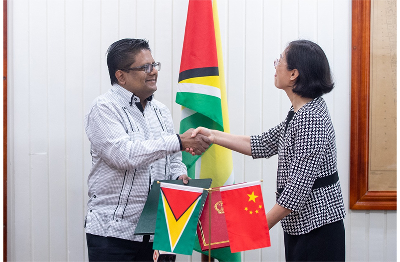 Senior Finance Minister Dr. Ashni Singh and Ambassador of the People’s Republic of China to Guyana, Guo Haiyan, shortly after signing the loan agreement (Ministry of Finance photo)