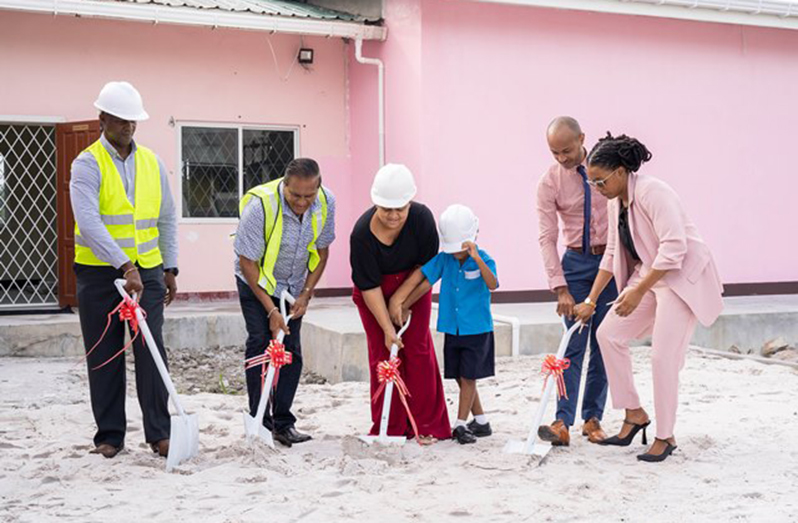 Education Minister Priya Manickchand; Permanent Secretary, Alfred King; Project donor, Teddy Mohammed; a student; Assistant Chief Education Officer with responsibility for Special Education Needs (SEN), Keon Cheong, and Senior SEN Officer, Nikoya Alleyne turn the sod for the Aquatic Therapy Pool
