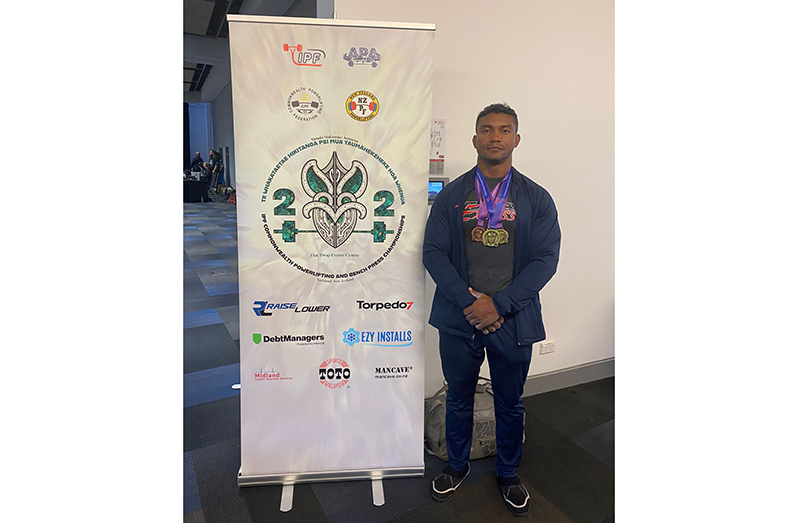 Carlos Petterson-Griffith poses with the three Commonwealth Championships medals.