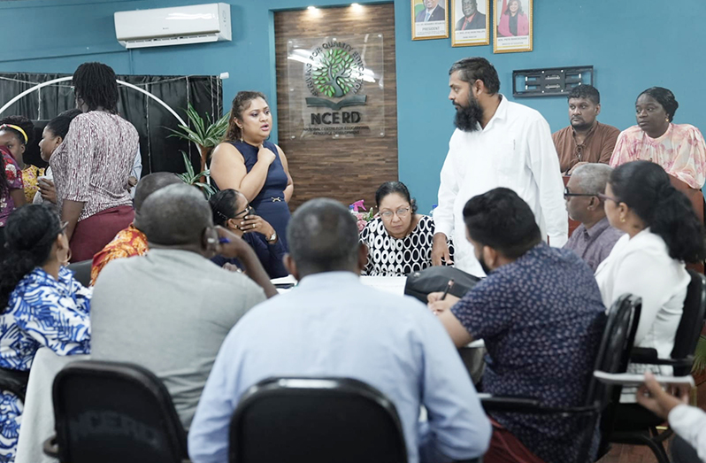 Education Minister Priya Manickchand and other officials of the ministry engage staff of the Christ Church Secondary School, on Friday