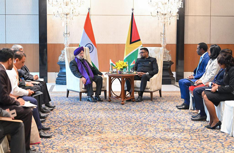 President, Dr. Irfaan Ali and the Minister of Petroleum and Natural Gas and Housing & Urban Affairs, Shri Hardeep S. Puri, along with their respective teams, in discussion, on Friday (Office of the President photo)