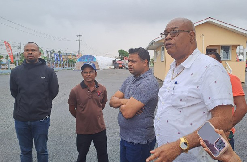 Ministers Juan Edghill and Deodat Indar during the meeting with sand truck operators and drivers