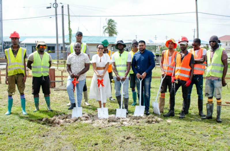 (From left)- Minister within the Office of the Prime Minister, Kwame McCoy; Tourism Minister, Oneidge Walrond; Local Government and Regional Development Minister, Nigel Dharamlall alongside residents and construction workers of North Sophia