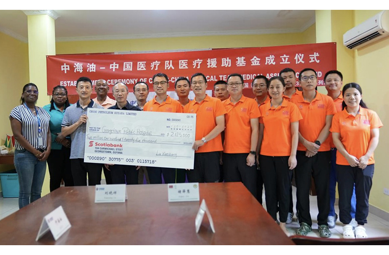 Officials of the 18th Chinese Medical Brigade and CNOOC Petroleum Guyana Limited (CPGL) after signing the CNOOC- Chinese Medical Team Medical Assistance Fund