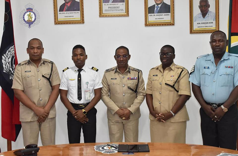 From left: Deputy Commissioner ‘Admin’ Calvin Brutus; Constable Troy Doris; Top Cop, Clifton Hicken; Head of SPU, Nicola Kendal and Sergeant Troy Doris senior (GPF photo) 
Picture saved as Proud
