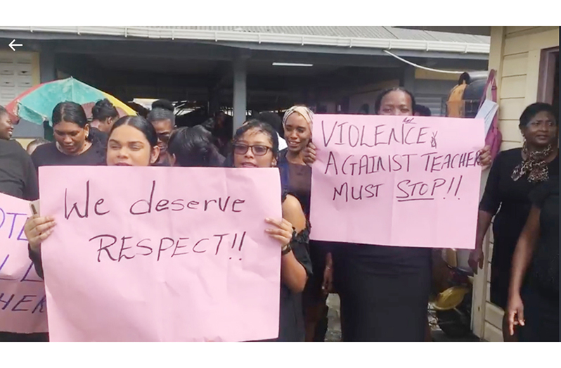 Teachers at the Grahams Hall Primary School on Thursday picketed and called for the removal of the child whose parent assaulted their colleague on Wednesday (Photo extracted from Royston Drakes Live Broadcast)