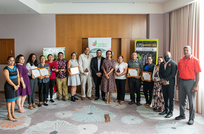 Representatives of the eco-lodges pose with their official Green Destinations - Good Travel Seal+ Certification and awards. Also pictured are Minister of Tourism, Industry and Commerce Oneidge Walrond and tourism officials (Delano Williams photo)