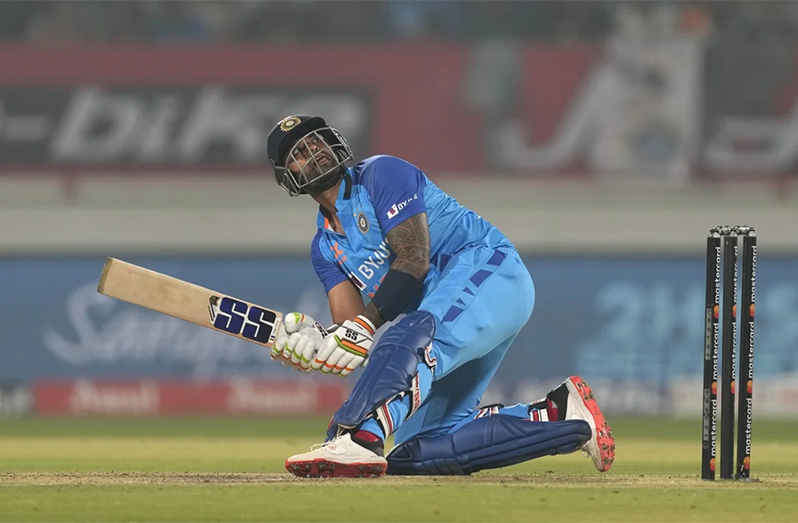 Suryakumar Yadav scoops and also enjoys the sight of it (Associated Press)