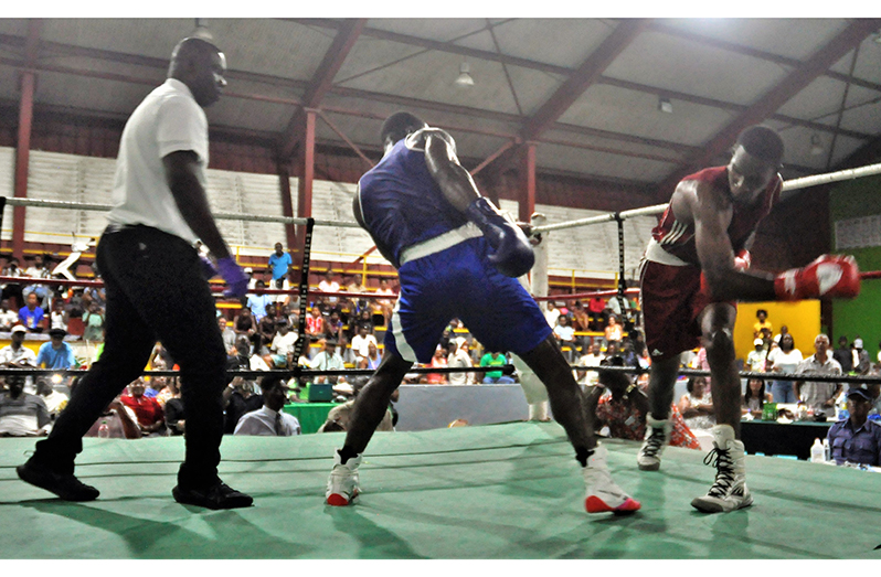 T&T’s Nikkett Joseph (right) misses a big right against Desmond Amsterdam
Photo saved: Big Right(Photos by Sean Devers).