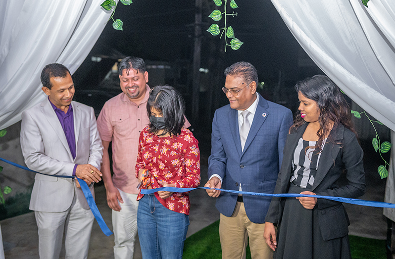 Speaker of the National Assembly, Manzoor Nadir joins other officials to cut the ceremonial ribbon to officially open Kanuku Tours Eco Lodge Resort (Delano Williams photo)