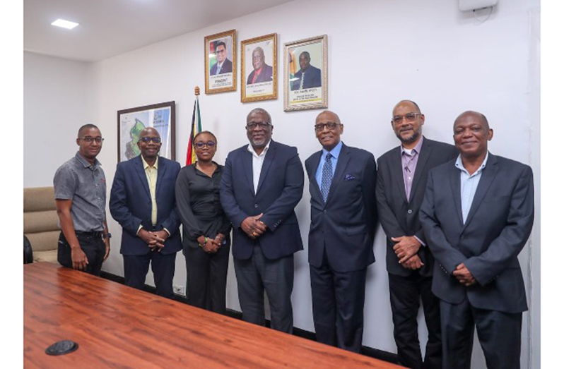 Prime Minister, Brigadier (Ret’d) Mark Phillips and the team from the Jamaica National Group