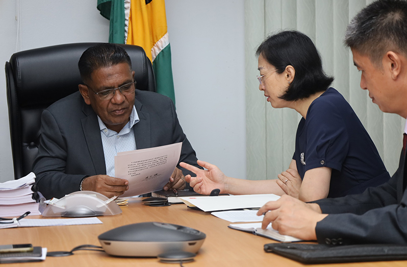 Minister of Agriculture, Zulfikar Mustapha and the Chinese Ambassador to Guyana, Her Excellency Guo Haiyan, at the meeting held in his office on Monday