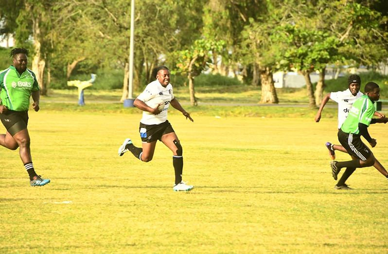 Sunday's top scorer Godfrey Broomes on his way to another try (Adrian Narine photo)
