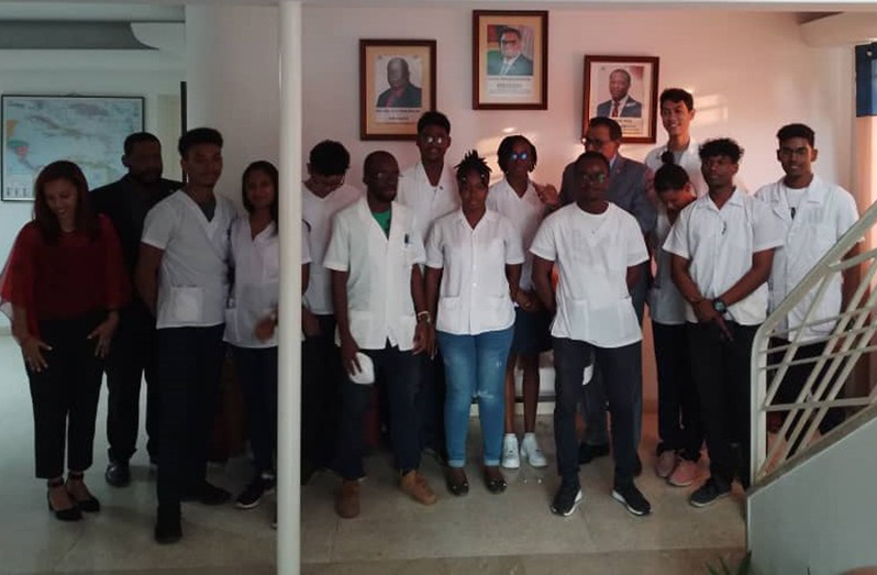 Ambassador Majeed and staff members at the Guyana Embassy with the students